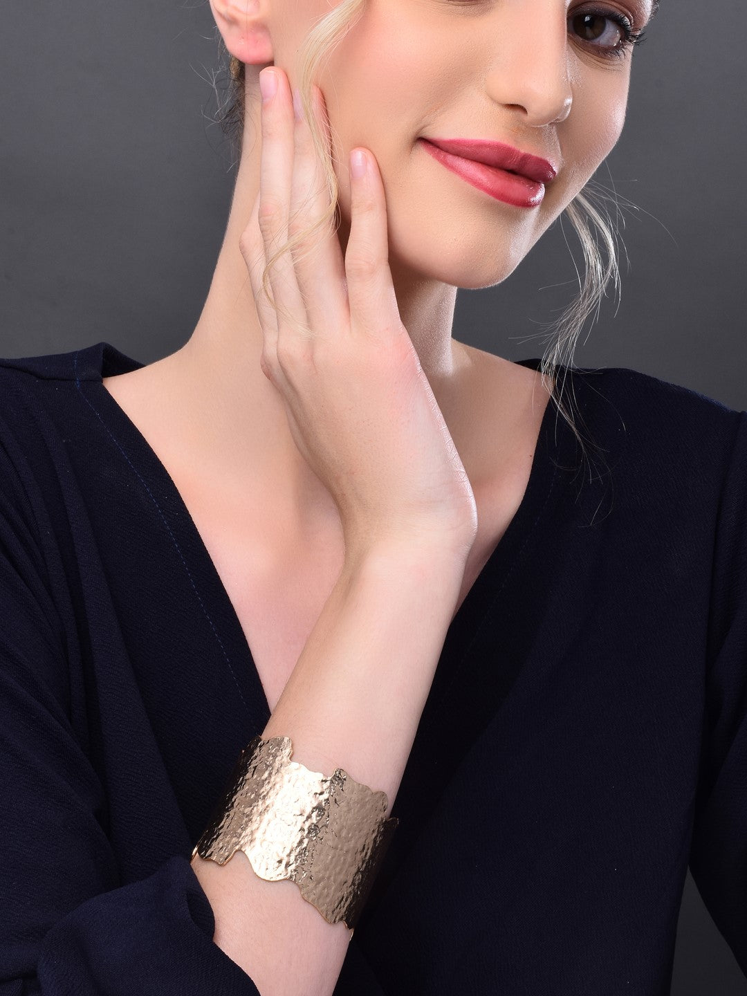 Gold hammered uneven cut gold bangle