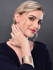 Gold hammered uneven cut gold bangle