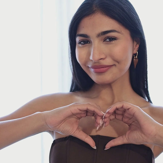 Love glaze heart earrings worn by model