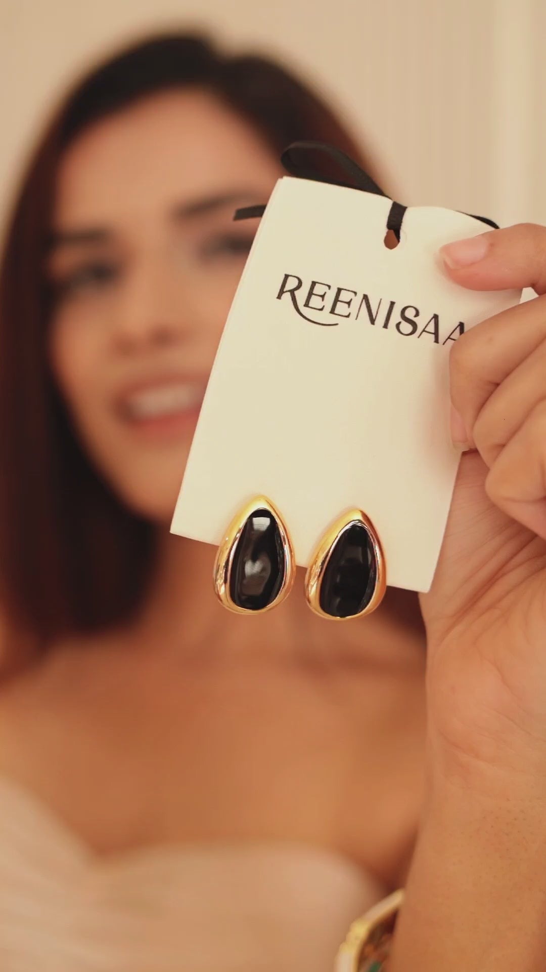 Drop earrings worn by model