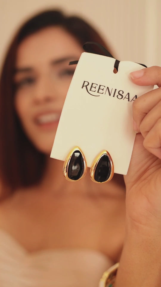 Drop earrings worn by model