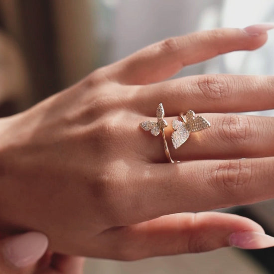 Golden twin butterflies ring on hand
